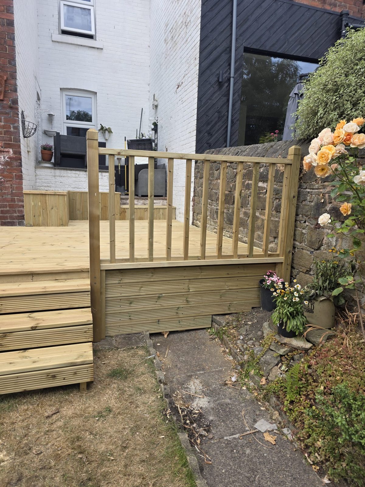Raised timber decking by Roebuck Gardening and Property Services